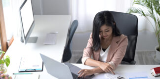 Accountant processing leave claims and payroll in integrated system