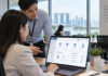 Why Employee Data Protection Matters When Choosing HR Tools hr manager demonstrating secure employee data management dashboard on laptop in office