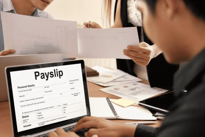 employee-viewing-digital-payslip-on-laptop-during-payroll-processing employee viewing digital payslip on laptop during payroll processing