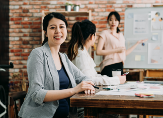 7 Signs Your SME Has Outgrown Manual HR Processes SME team meeting to streamline manual HR workflow processes.