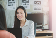 smiling-businesswoman-job-interview-laptop-office