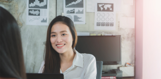 smiling-businesswoman-job-interview-laptop-office