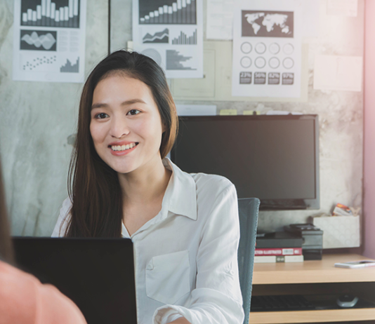 smiling-businesswoman-job-interview-laptop-office
