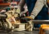 Manufacturing Job Costing Software: Labour Cost by Job, Batch, or Project factory-worker-cutting-metal-pipe-in-manufacturing-labour-production
